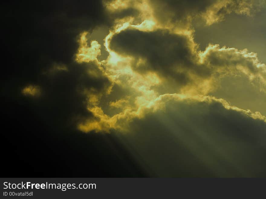 Bright sun shining through clouds. Bright sun shining through clouds