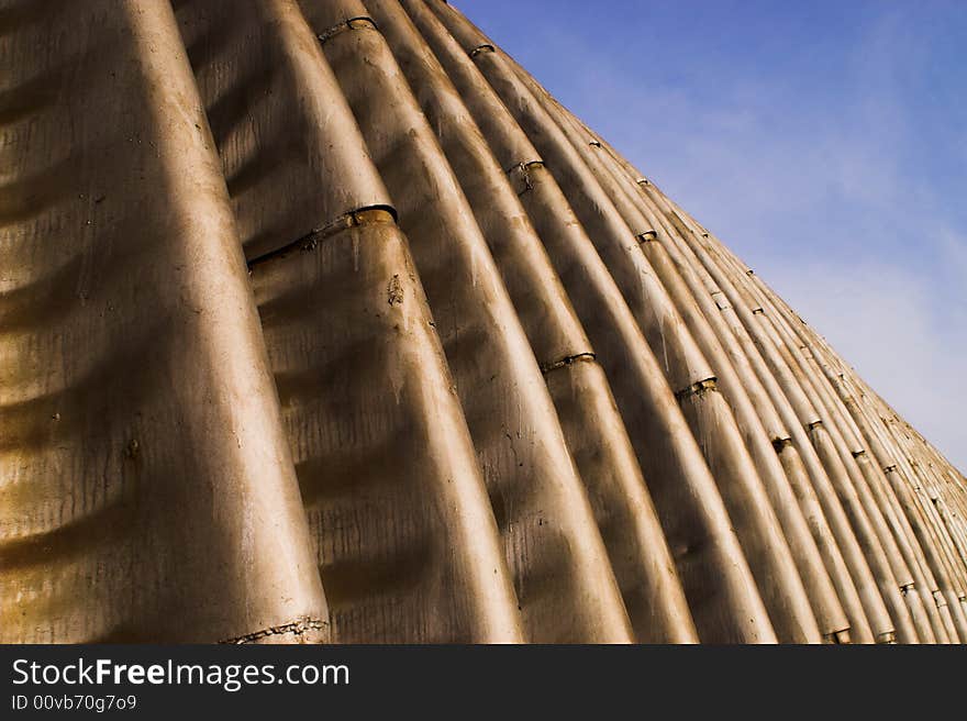 Abstract metal construction on clear  blue sky. Abstract metal construction on clear  blue sky