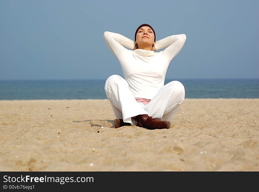 Attractive brunette woman on the beach. Attractive brunette woman on the beach