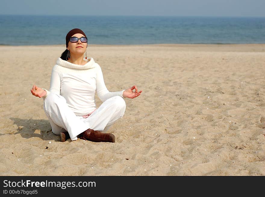 Attractive brunette woman on the beach. Attractive brunette woman on the beach