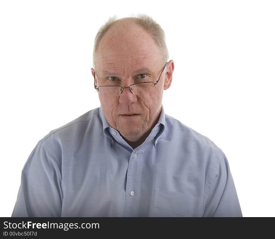 An older guy in a blue shirt and glasses, looking over the rims. An older guy in a blue shirt and glasses, looking over the rims