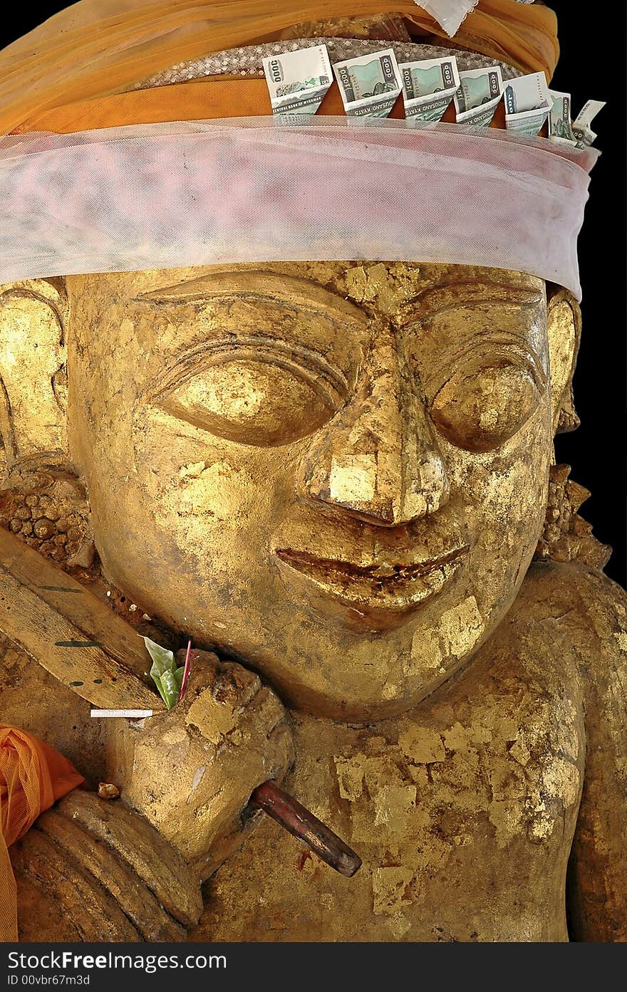 Myanmar, Bagan: Statue in a pagoda; very special sculpture with  US dollars in his hat