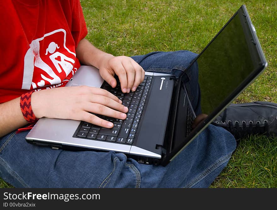 Human hand pressing a key on a laptopkeyboard. Human hand pressing a key on a laptopkeyboard