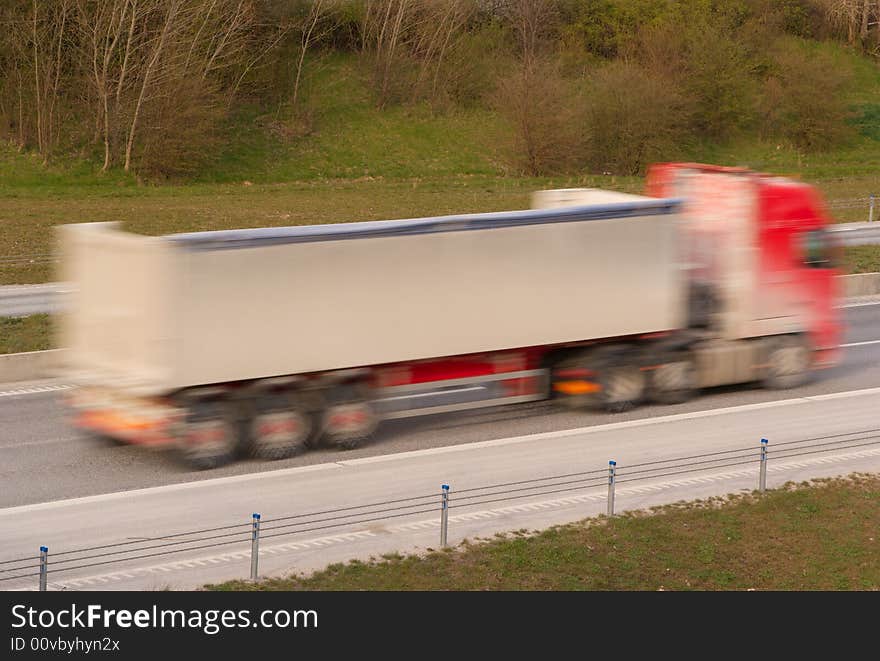 A truck travelling at high speed. A truck travelling at high speed