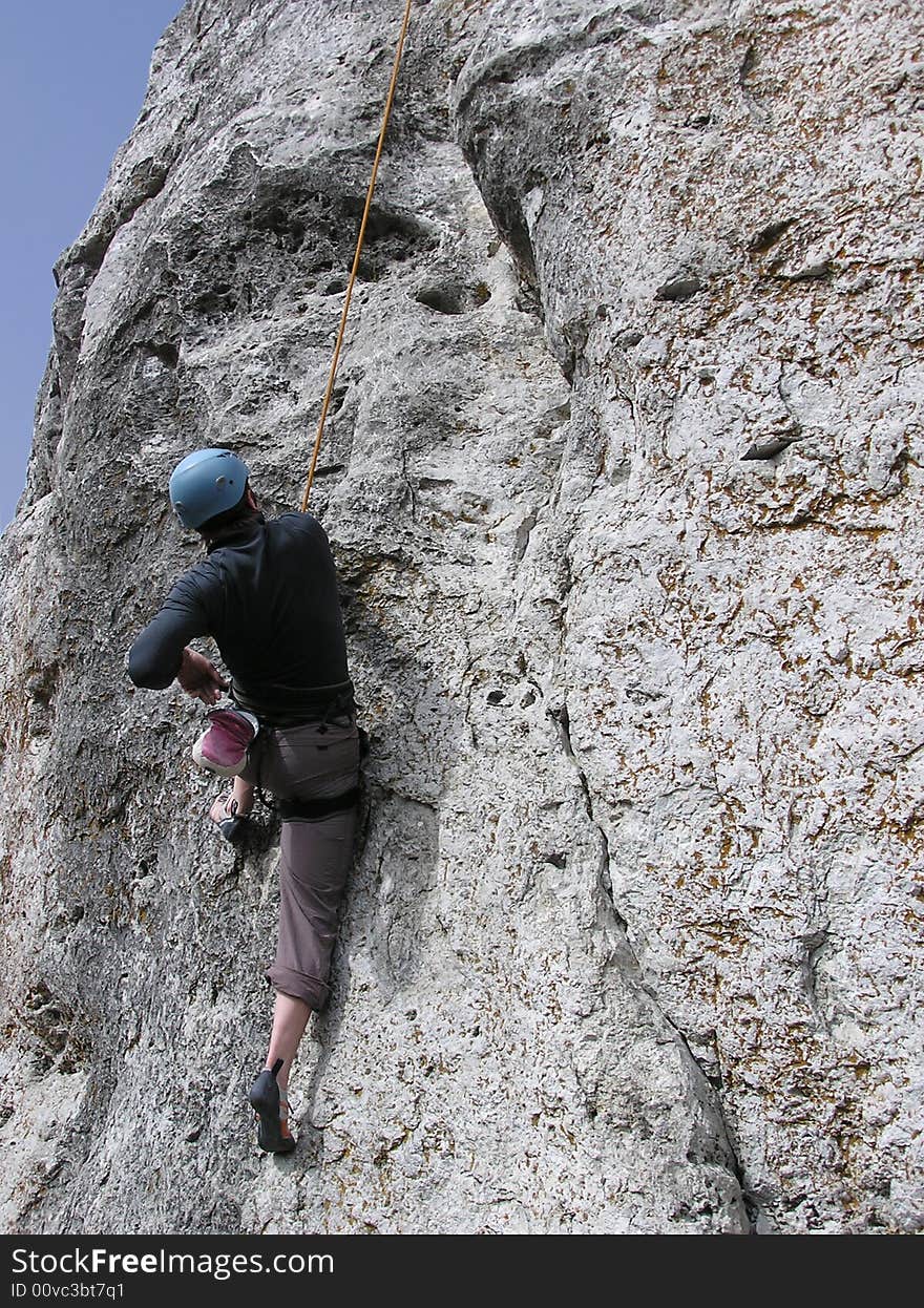 A male rock-climber on training