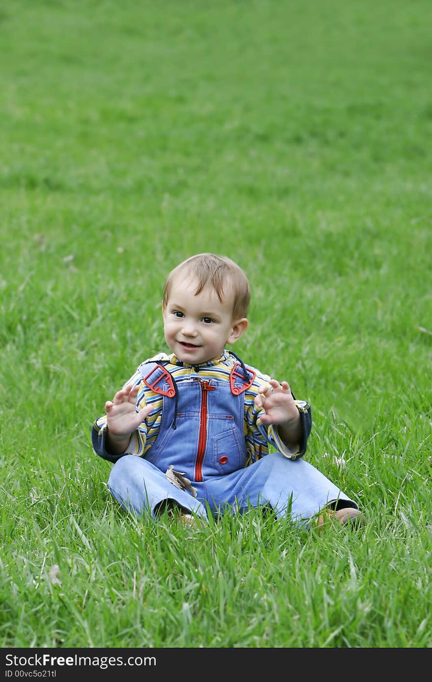 Happy baby boy on natural background