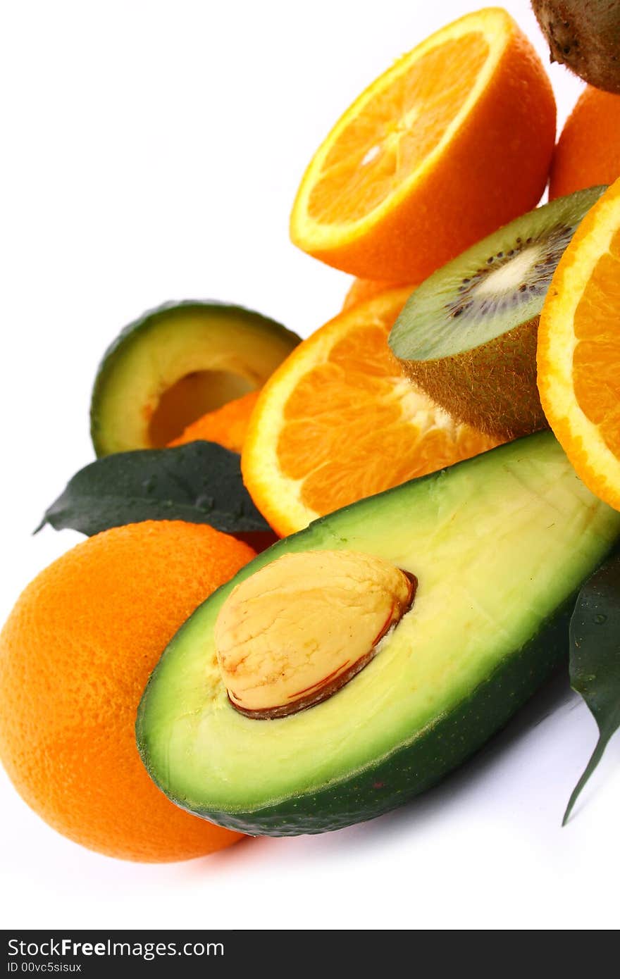 Fresh avocados with other fruits  isolated on white background