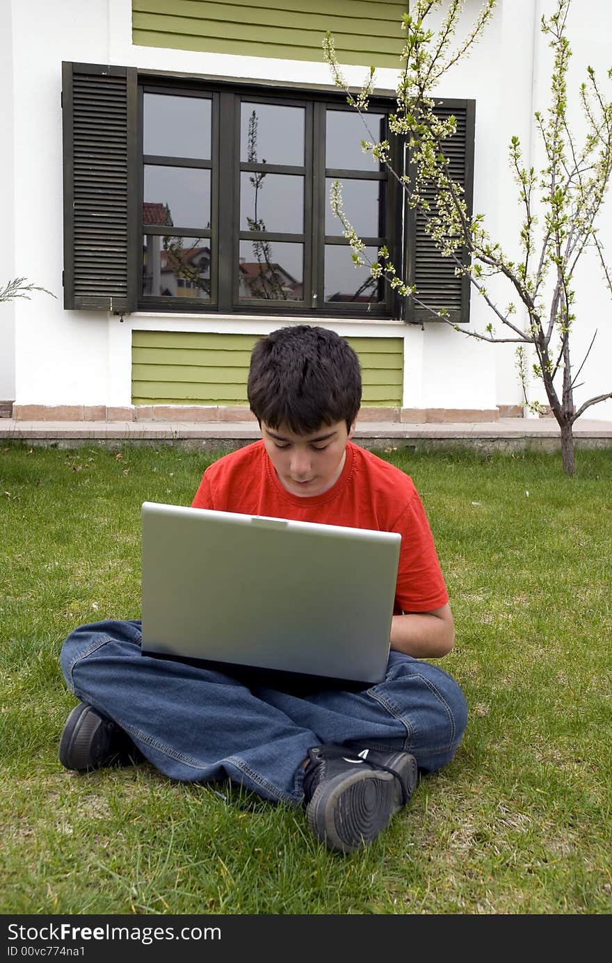 Human hand pressing a key on a laptopkeyboard. Human hand pressing a key on a laptopkeyboard