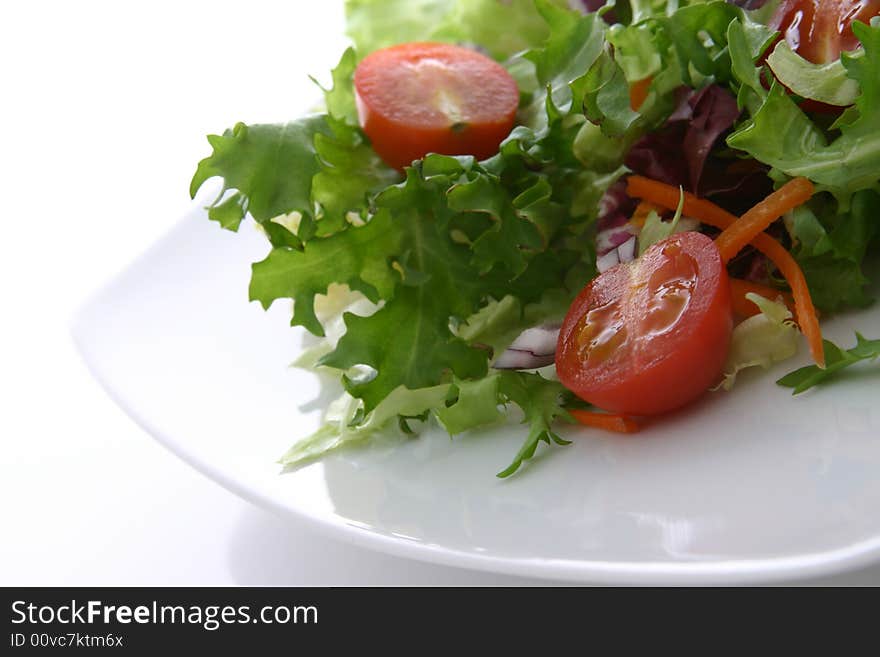 Healthy salad with lettuce, carrots, tomato