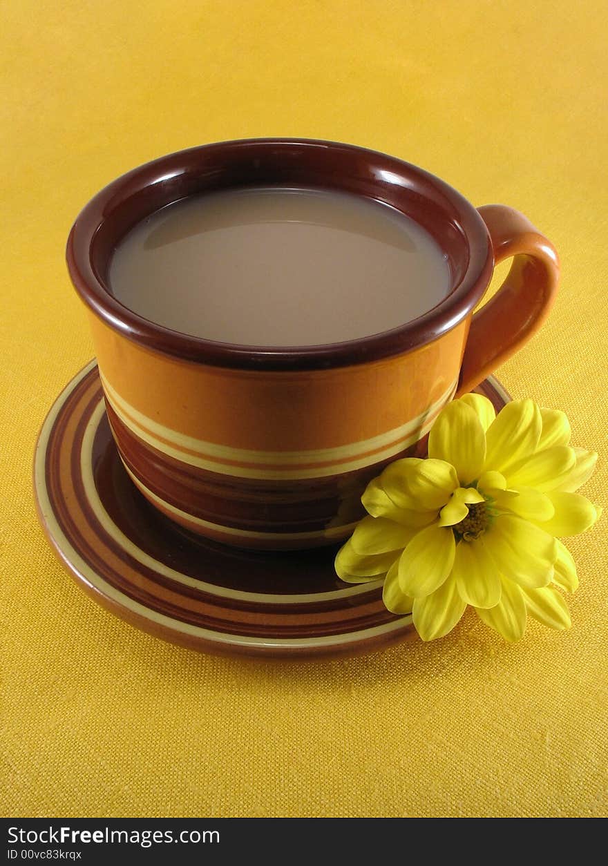 Ceramic cup of tea on the yellow napkin. Ceramic cup of tea on the yellow napkin