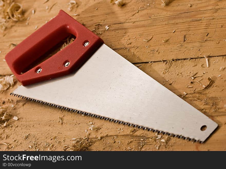 Tools series: saw with red plastic handle