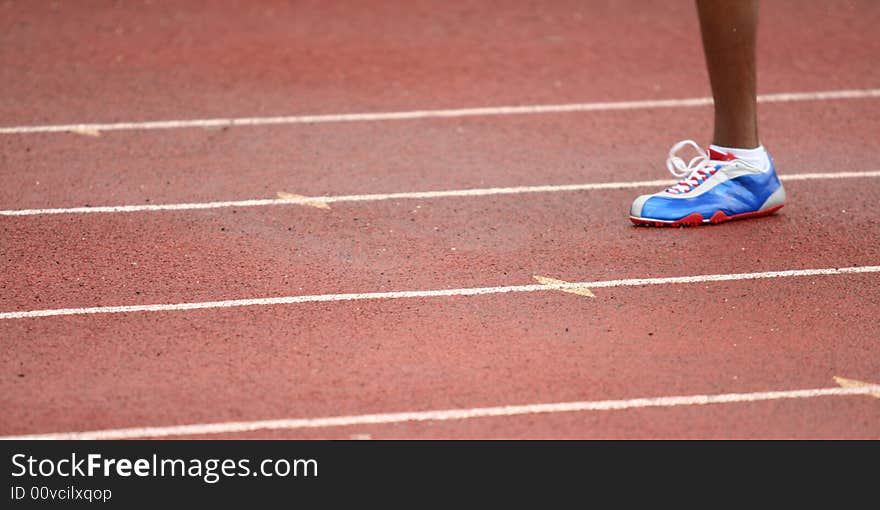 Single foot of a runner during a race. Single foot of a runner during a race