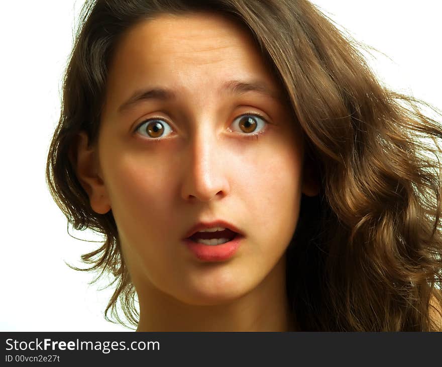 A pretty lady with sidelong brown hair is surprised and her mouth is opened