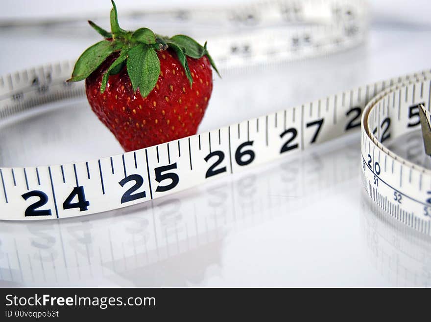 Ripe strawberry with a tape measure. Ripe strawberry with a tape measure.