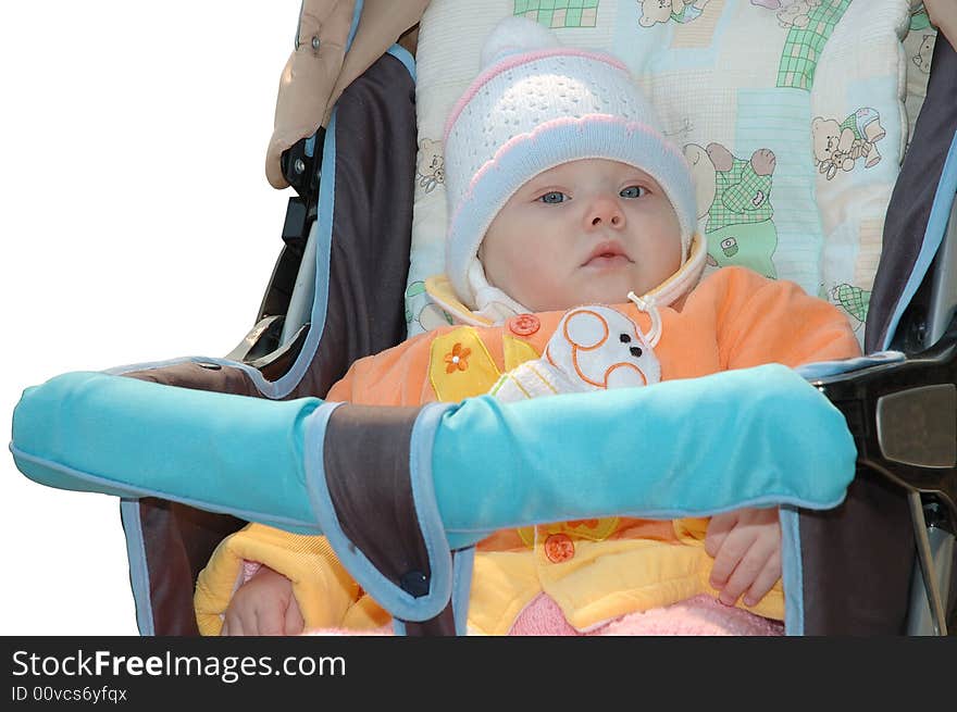 Little girl in bright clothes sit in carriage. Little girl in bright clothes sit in carriage.