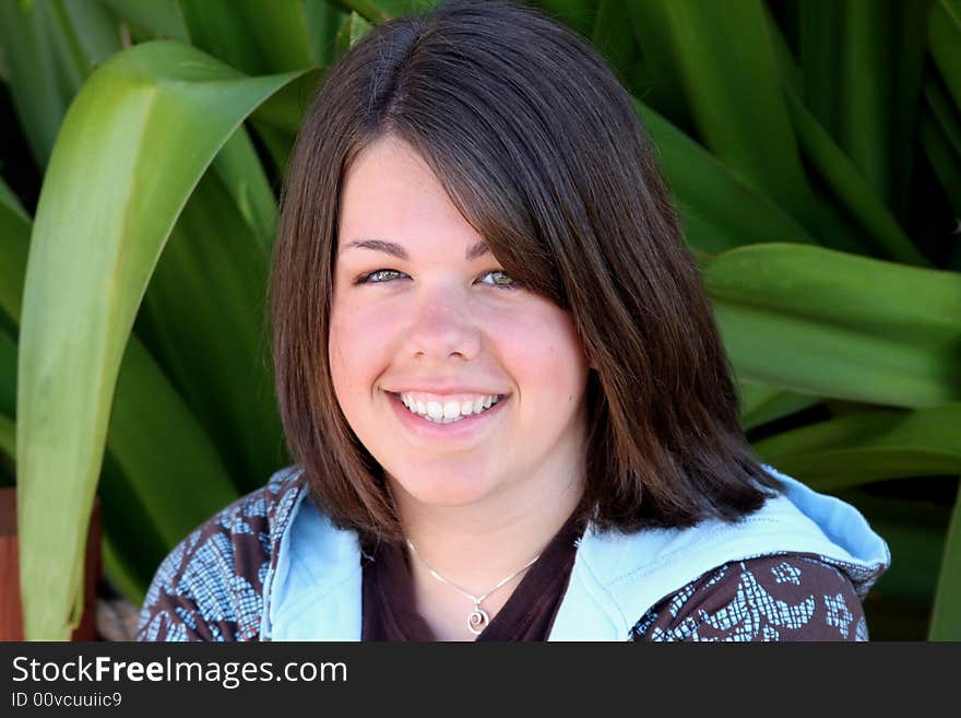 A 17 year old teenager posing for a high school senior portrait. A 17 year old teenager posing for a high school senior portrait.