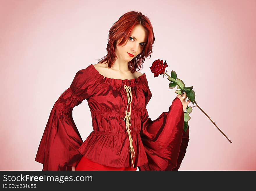 Cute redhead girl with red rose. Cute redhead girl with red rose