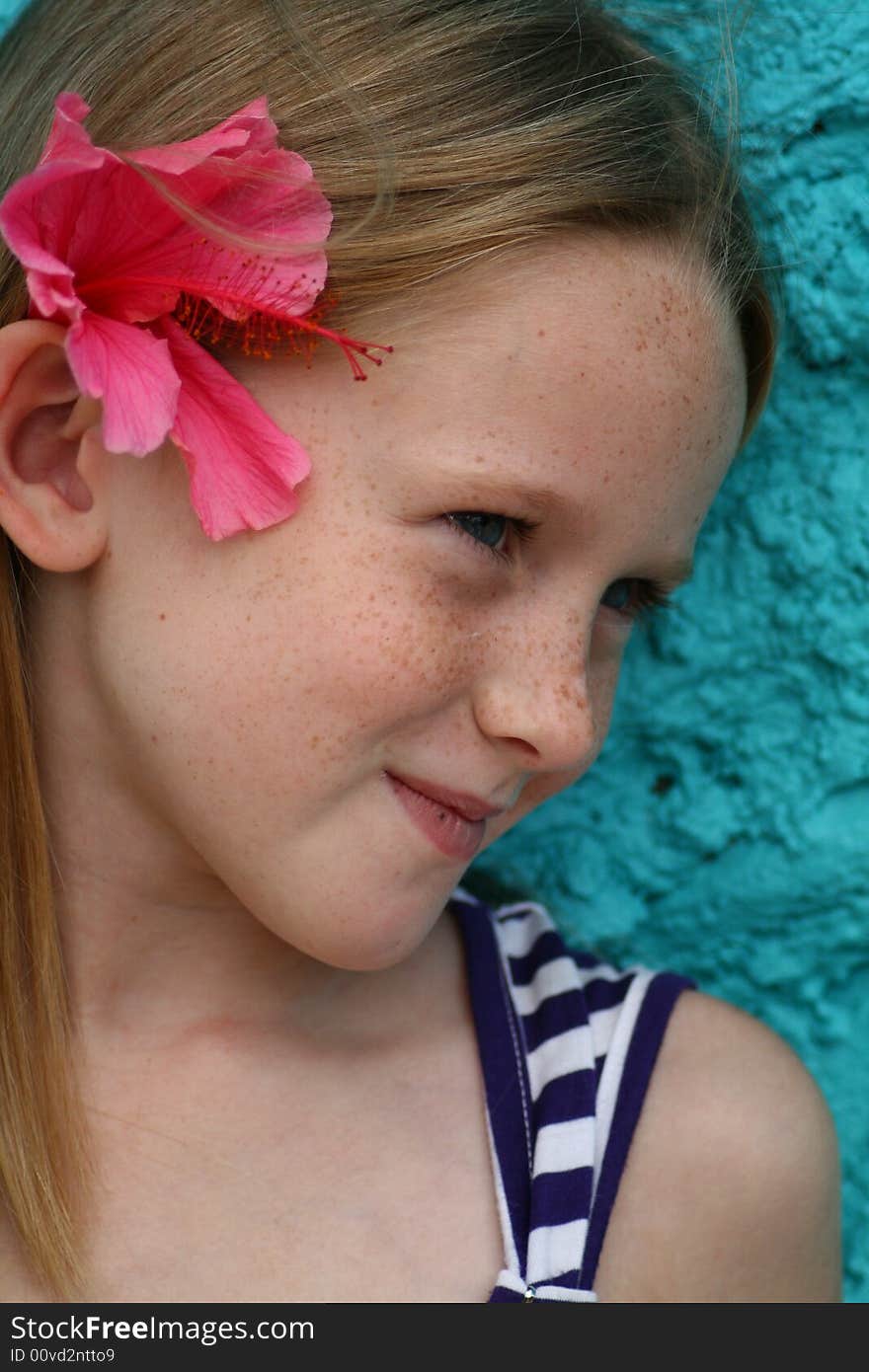 A white cuacasian girl child with a happy expression on her face. A white cuacasian girl child with a happy expression on her face