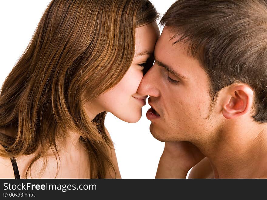 Young adult couple in the studio kissing. Young adult couple in the studio kissing