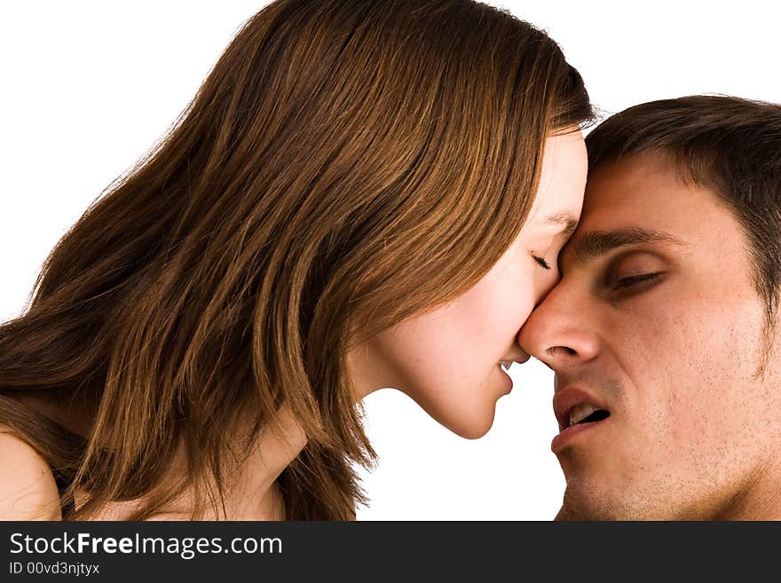 Young adult couple in the studio kissing. Young adult couple in the studio kissing