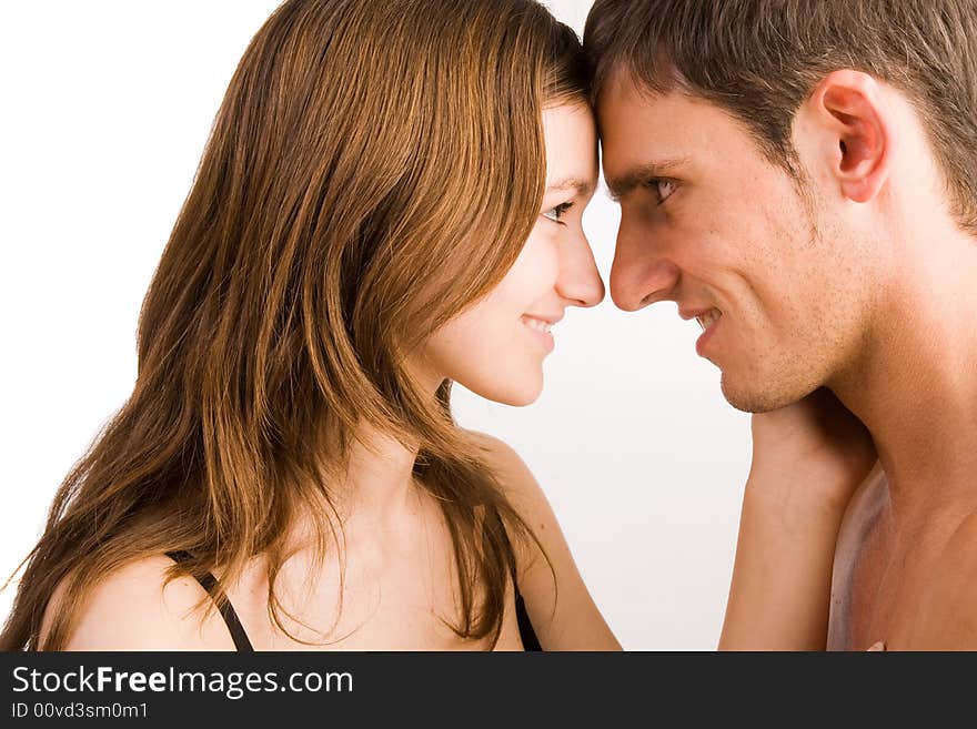 Young adult couple in the studio kissing. Young adult couple in the studio kissing