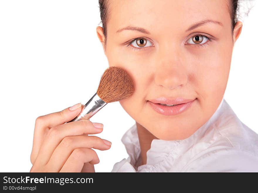 Make up. woman with brush on a white