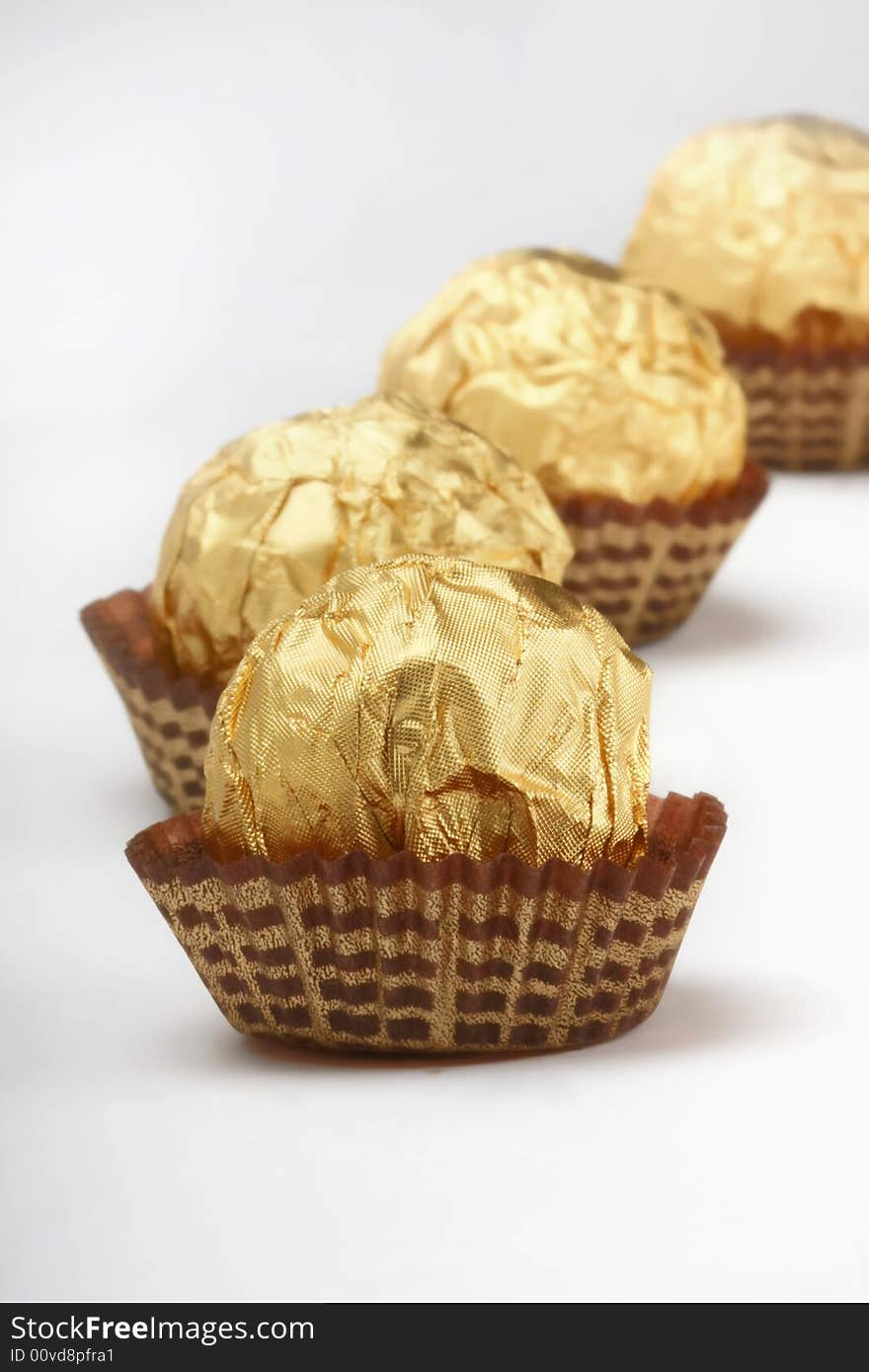 Chocolate truffles foil wrap gold. Chocolate truffles foil wrap gold