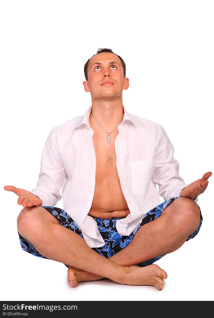 Man sitting in pose of lotus on white. Man sitting in pose of lotus on white