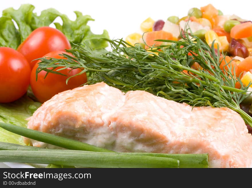 Stake from a salmon with vegetables on a plate