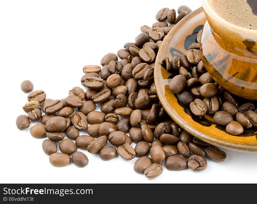 Coffee beans and black coffee in a cup isolated on a white background