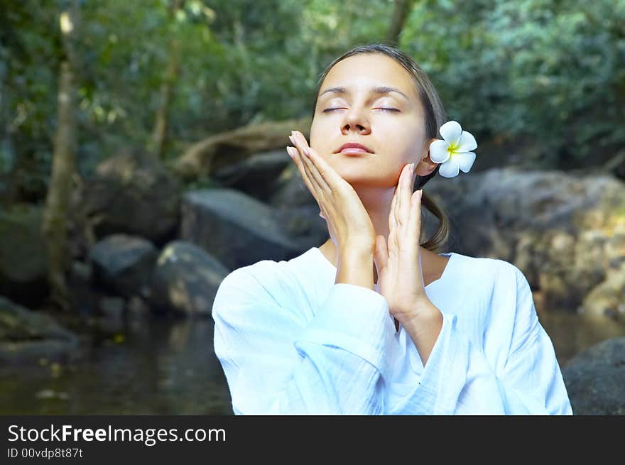 Portrait of fresh and beautiful human with flower in summer environment. Portrait of fresh and beautiful human with flower in summer environment