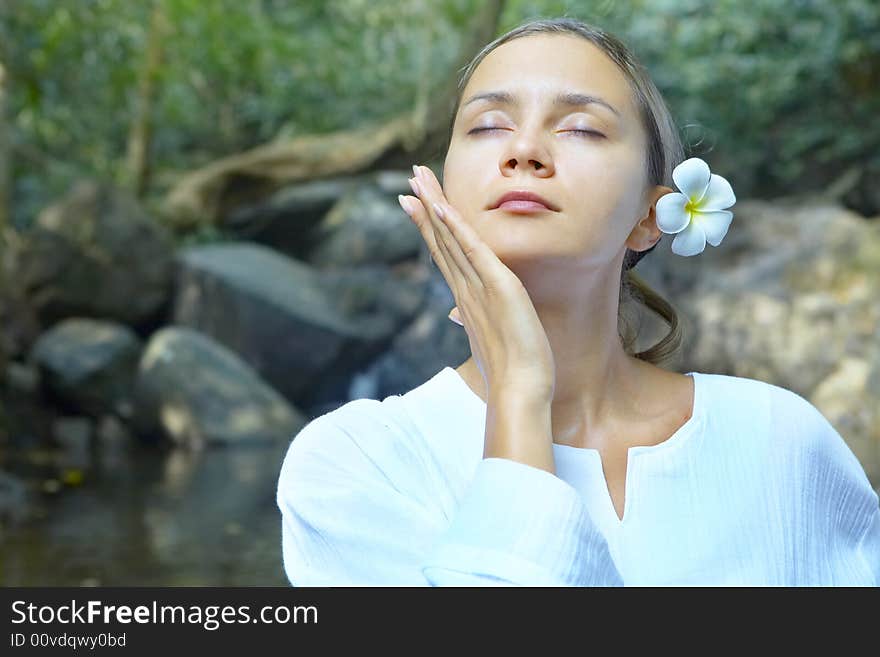 Portrait of fresh and beautiful human with flower in summer environment. Portrait of fresh and beautiful human with flower in summer environment