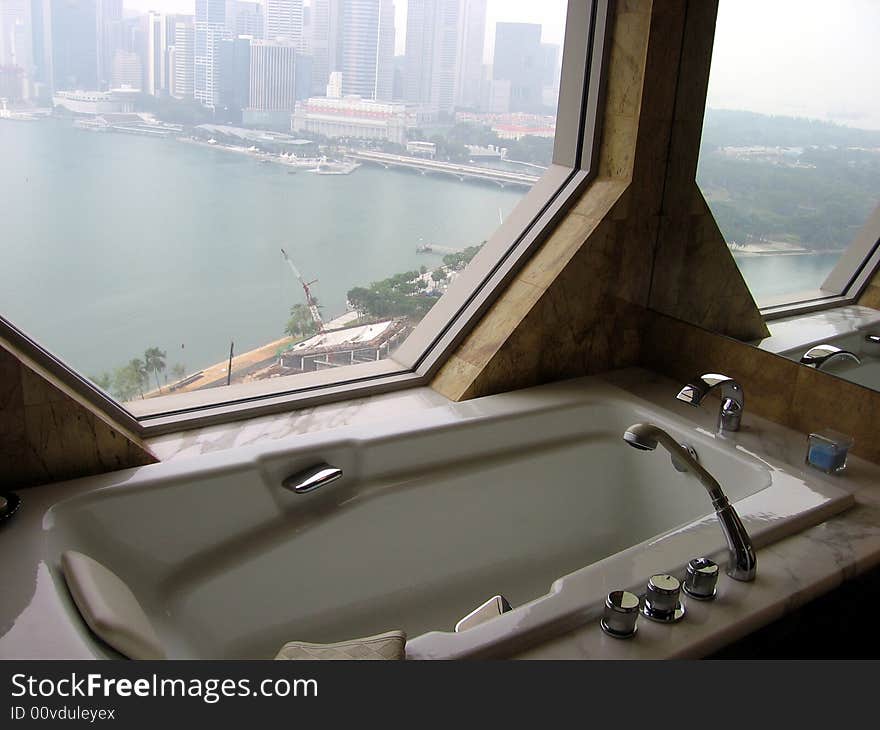 Hotel bathroom with city view. Hotel bathroom with city view