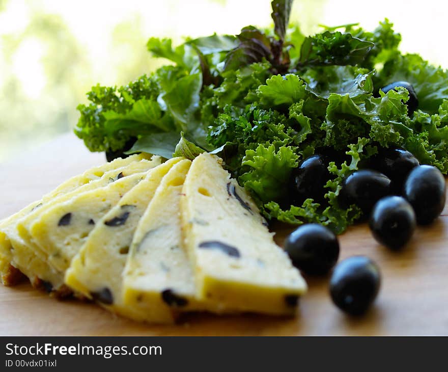 Cheese with olive and green salad