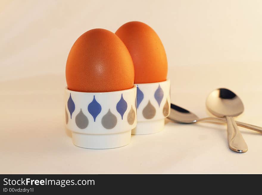 Two eggs in eggcups isolated