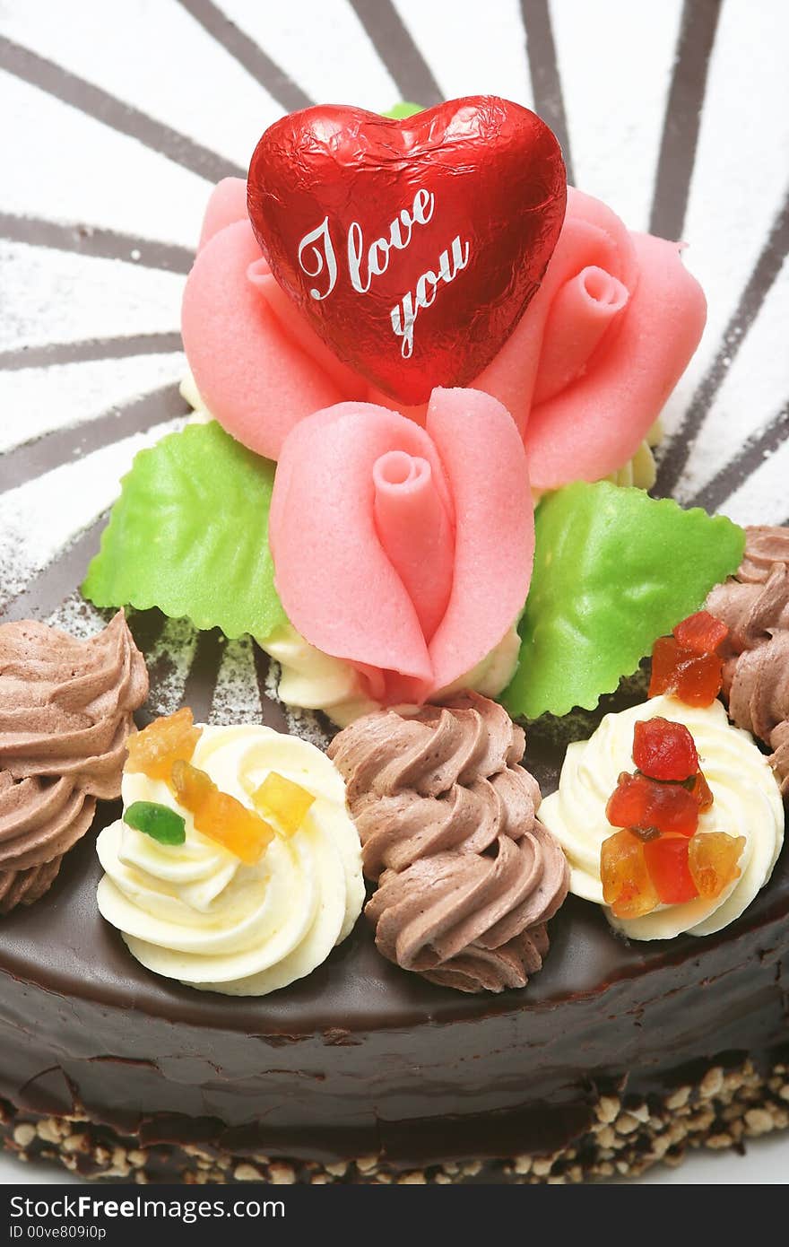 Close up of the iced roses on a chocolate cake.