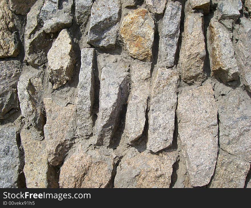 Wall from the stones fastened by cement