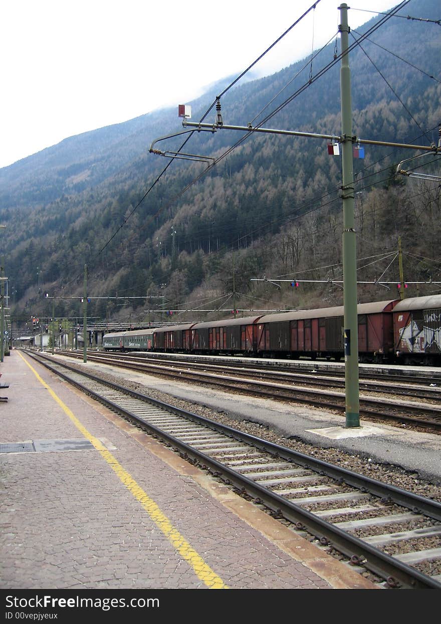 A goods train stopped in a train station