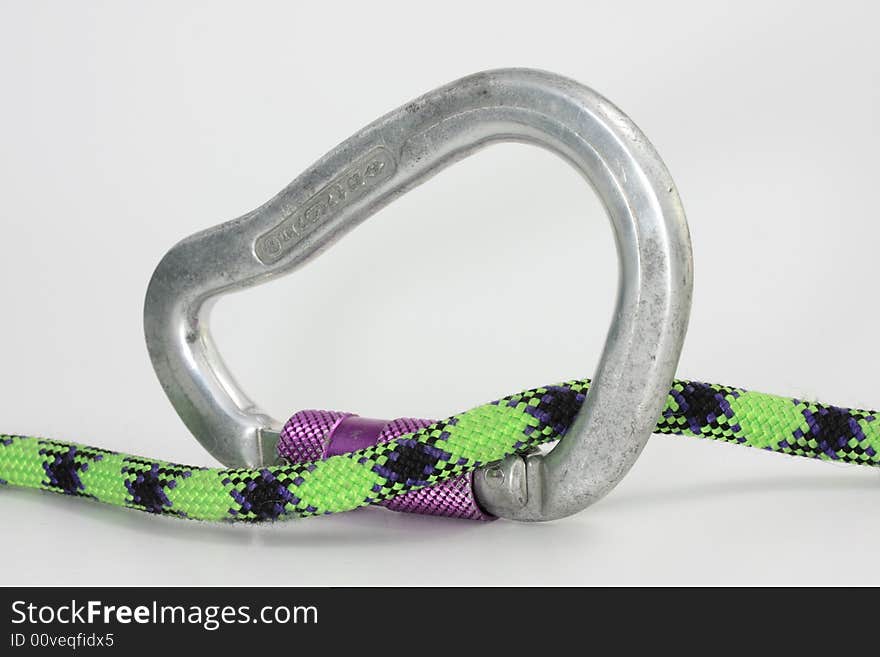 A detail of climbing gear on white background