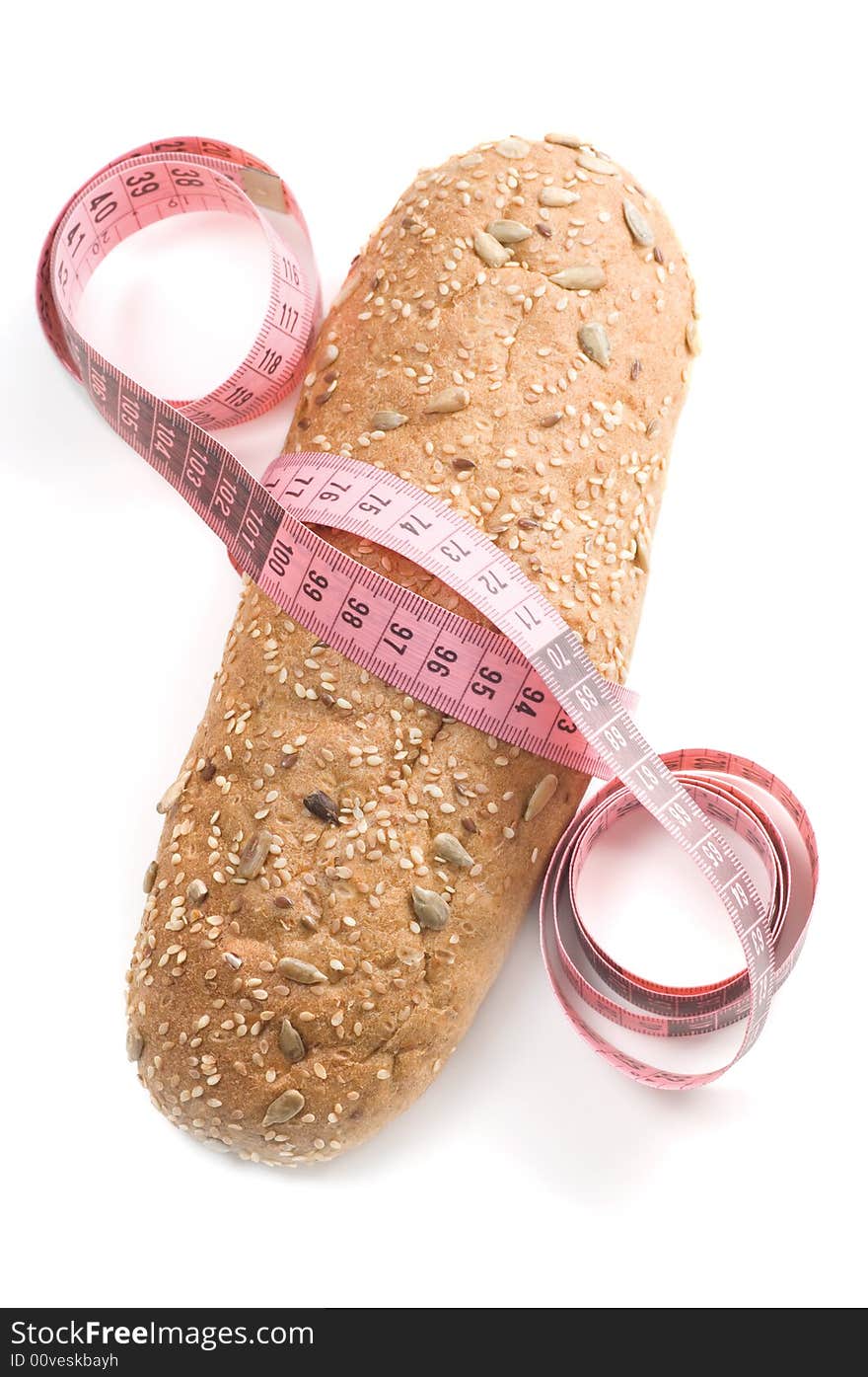 Bread wrapped with a measurement tape on a white background