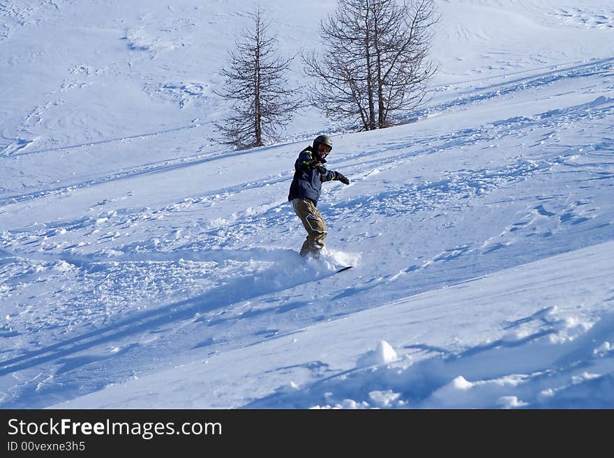 The snowboarder in a mountain (extreme sport). The snowboarder in a mountain (extreme sport)