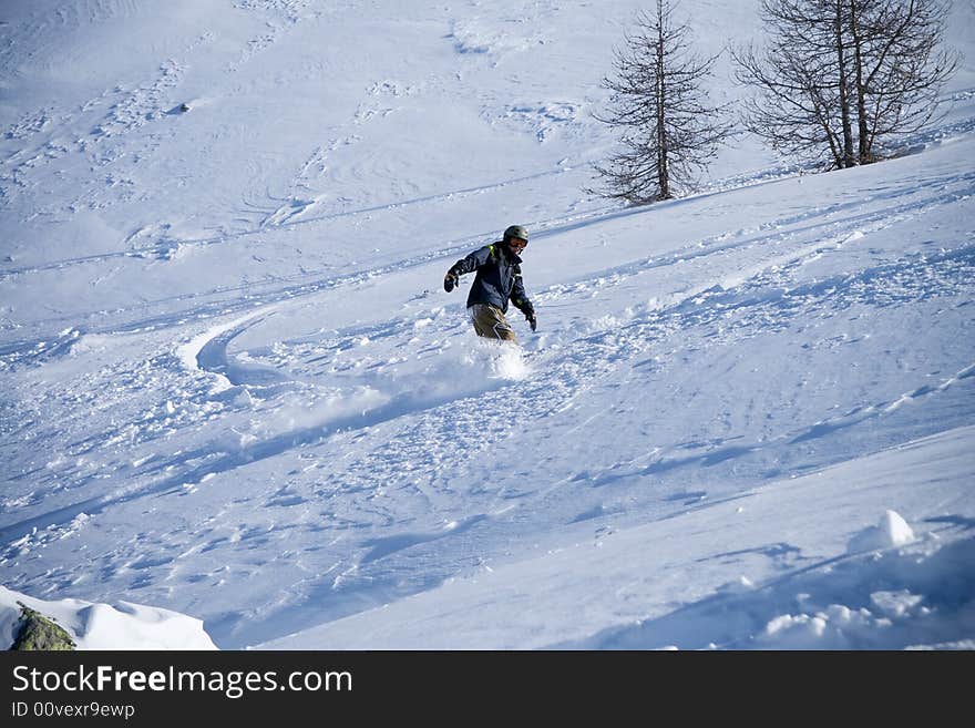 The snowboarder in a mountain (extreme sport). The snowboarder in a mountain (extreme sport)