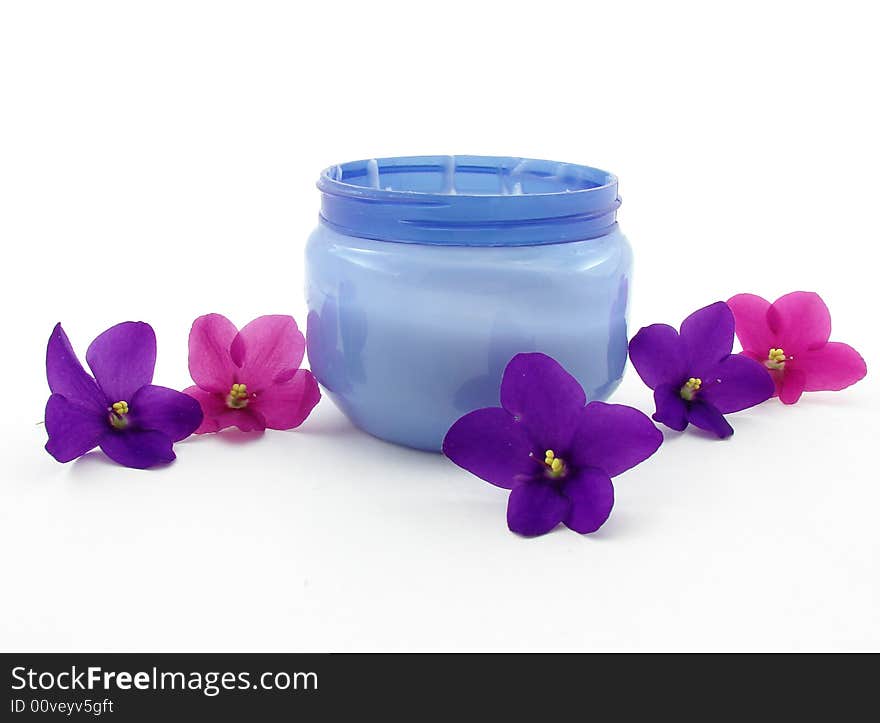 Violets and bod cream isolated on white background. Violets and bod cream isolated on white background.