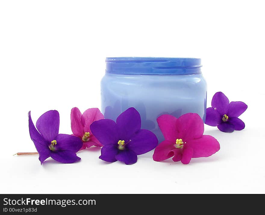 Violets and bod cream isolated on white background. Violets and bod cream isolated on white background.