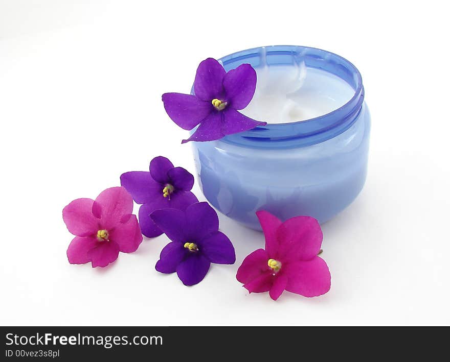 Violets and bod cream isolated on white background. Violets and bod cream isolated on white background.