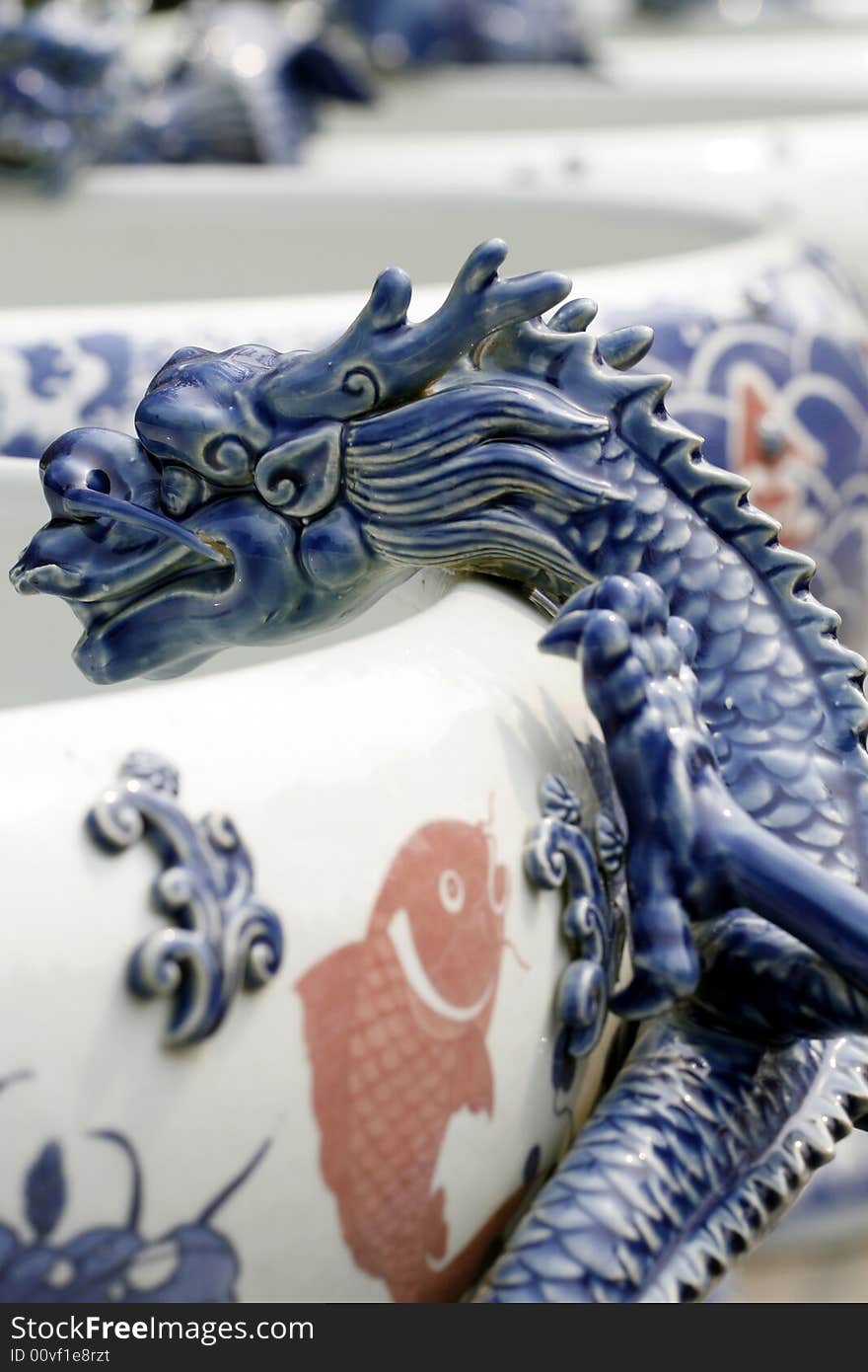 The Chinese porcelain is made decorating on the jar. Dragon shape. The Chinese porcelain is made decorating on the jar. Dragon shape.