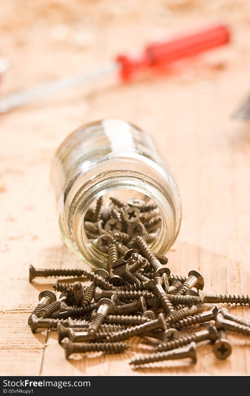 Tools series: some metal screw on the wooden plank. Tools series: some metal screw on the wooden plank