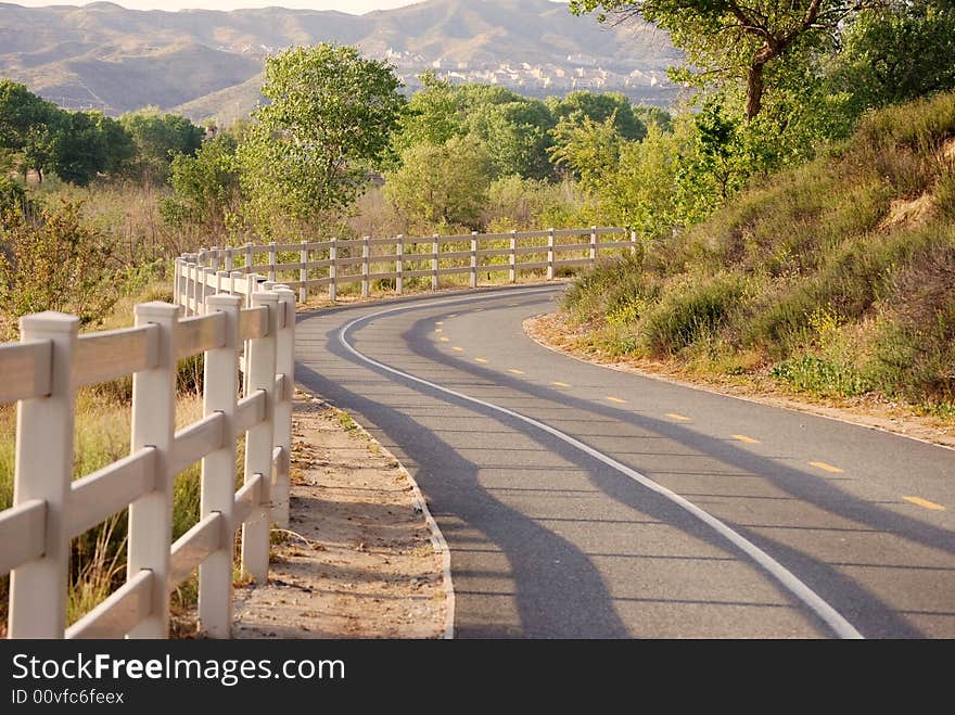 A bike path winds through the hills.