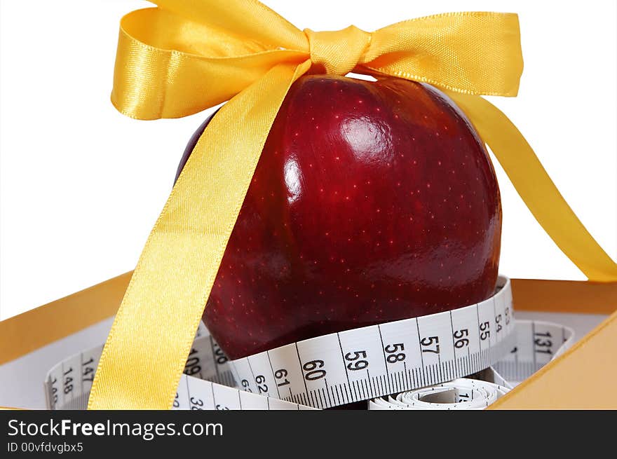 Red apple in box with tape-line like gift