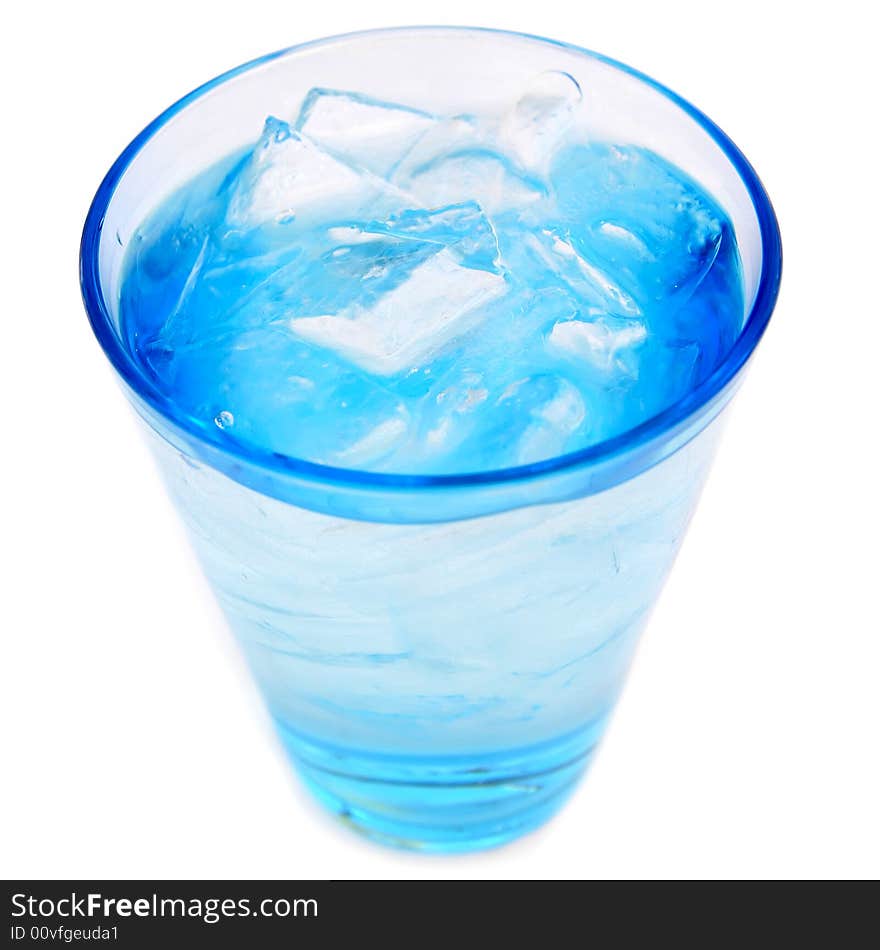 A glass of cold blue ice water isolated on white